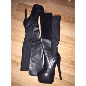 Black flat form knee high boots