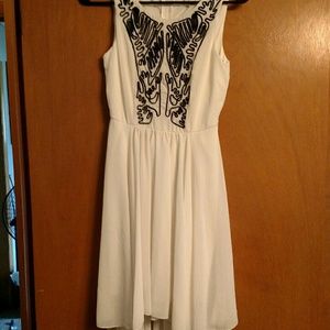 White high low dress with black embellishments