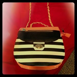 Black, white,and peach colored purse
