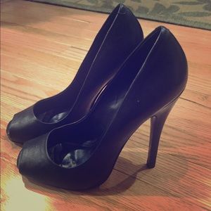 Black leather pumps