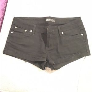 Black shirt shorts. Jean.