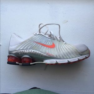 Orange white and silver Nike shox