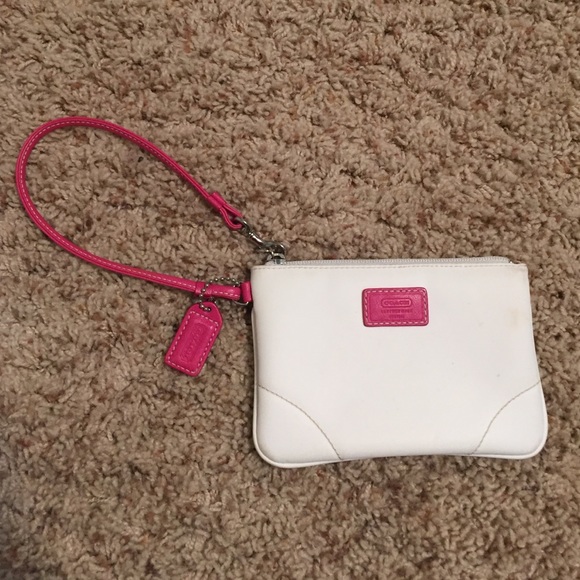 white and pink coach wristlet