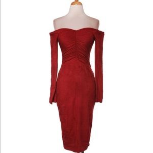 Red-off shoulder dress gathered at front.