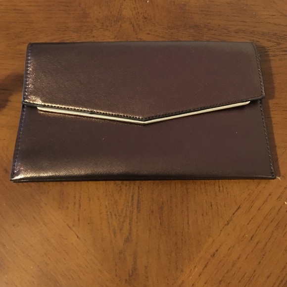 Brown clutch with removable gold strap. Never used
