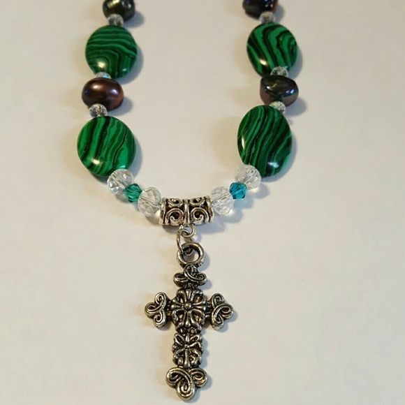 Cross necklace with emerald/purple color accents