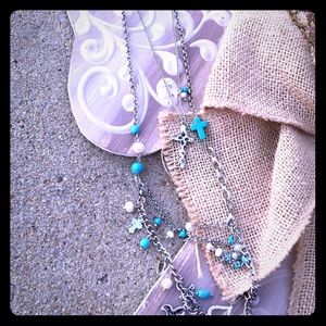 A gorgeous cross earring and necklace set.