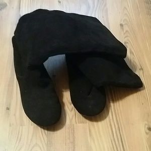 Black suede knee high boots.