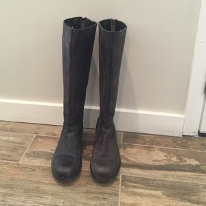 Steve Madden boots in a black distressed leather.