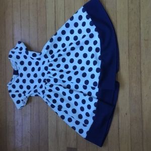 A navy polka dot dress