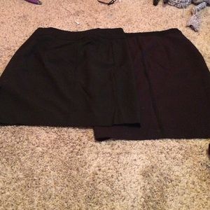 2 black mid-length skirts