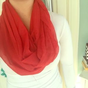 Three solid colored scarves