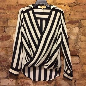Trendy black + white striped V neck blouse