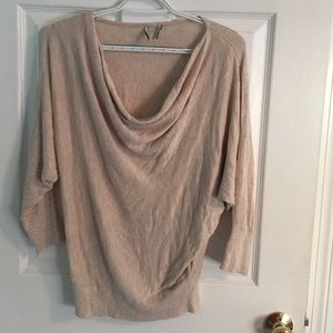 Tan sweater. Lightly worn