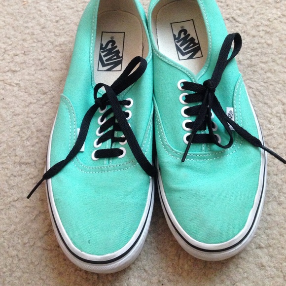 Teal vans with black lining and white bottoms