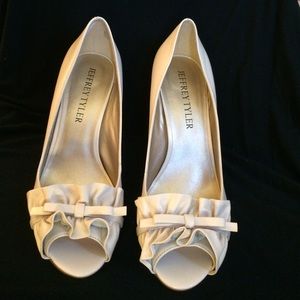 Ivory peep toe with ruffle heels