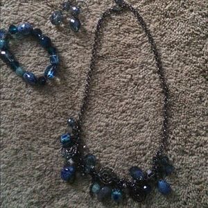 Necklace, earrings and bracelet.