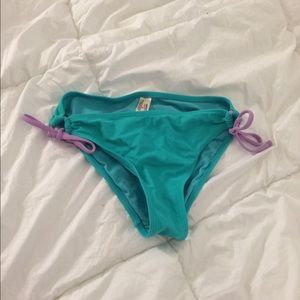 Teal bikini bottoms with purple string ties
