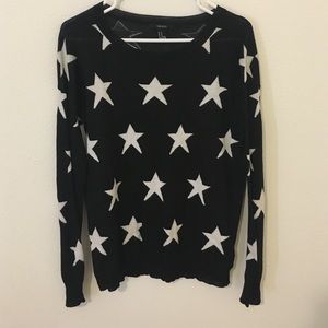 Lightweight black sweater with white stars