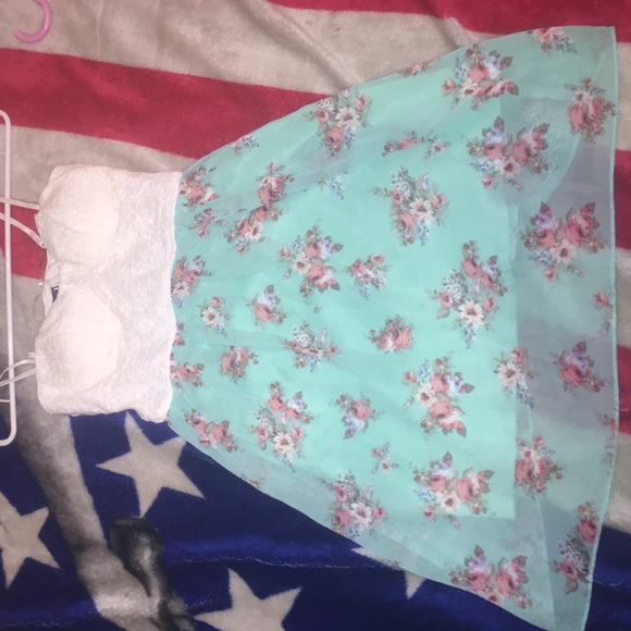 A dress with floral pattern on the bottom - Picture 1 of 2