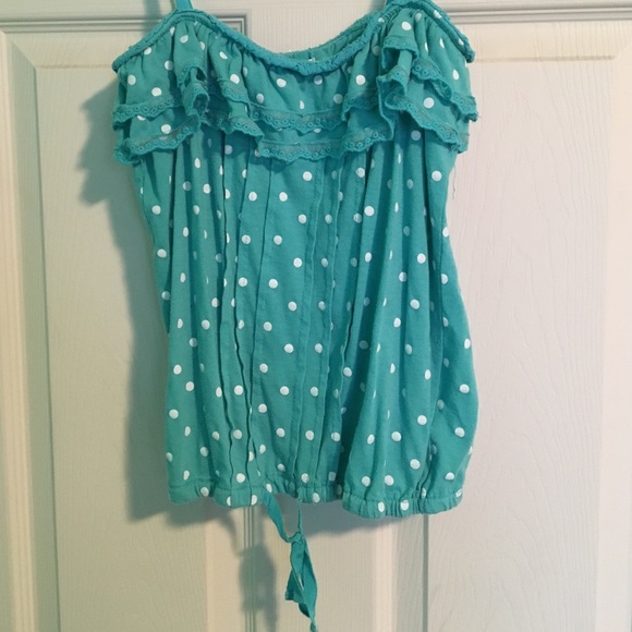 A blue w/ white polka dot tank top
