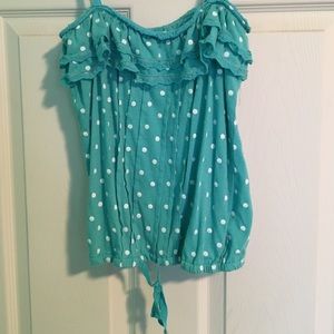 A blue w/ white polka dot tank top