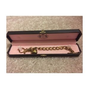 Gold Juicy Couture bracelet.