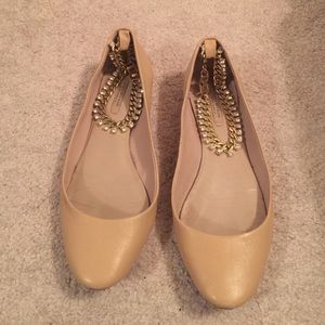 Tan ballet flats with bejeweled ankle chain clasp
