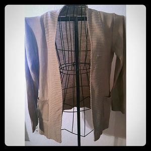Tan two pocket cardigan by Ambiance Apparel.