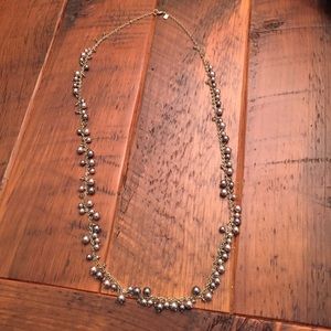 Long, silver beaded necklace