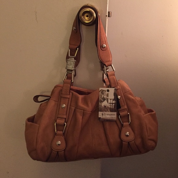 Brand new tan glove leather handbag. With tags