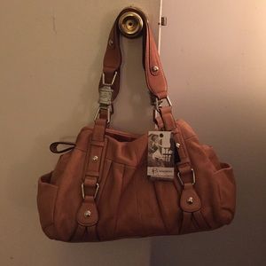 Brand new tan glove leather handbag. With tags