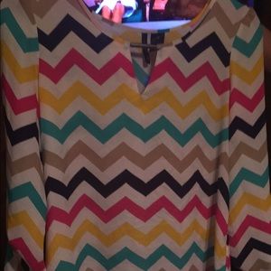 It's long in the back.. Never worn!