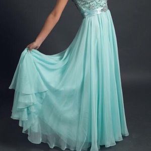 Mint colored prom dress with a bustle and train