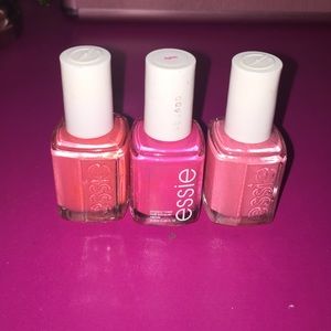 Three Essie nail polishes in shades of pink