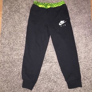YL would fit women small: Nike joggers