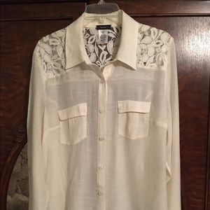 Cream colored blouse.