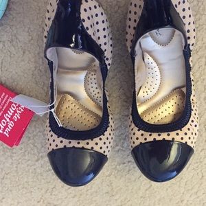 Tan and navy blue ballet flats