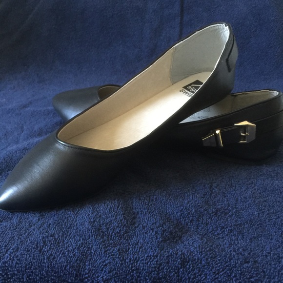 Black flats with gold buckle
