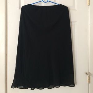 Knee length black skirt
