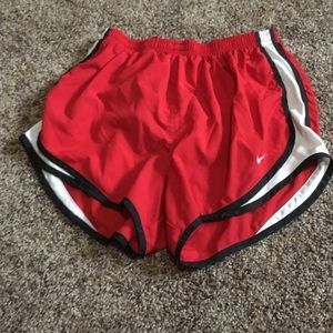 Red Nike running shorts size M. Basically new.