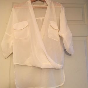 Sheer White High Low Blouse with a deep V neckline