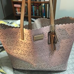 Pink metallic Coach bag with attachable makeup bag