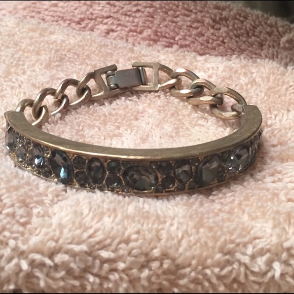 Kenneth Cole brushed gold with graphite stones.