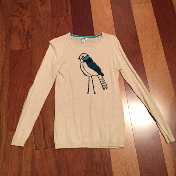 Tan sweater with bird