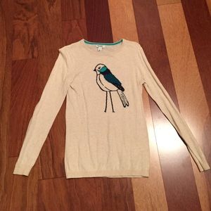 Tan sweater with bird