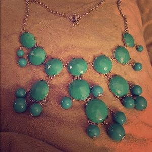 Turquoise and silver necklace.