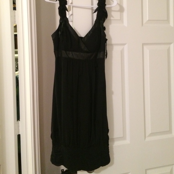 Black silk rayon dress with flower detail.