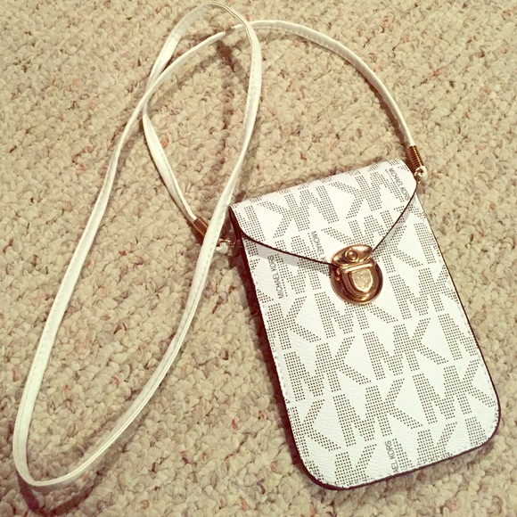 White Micheal Kors purse.