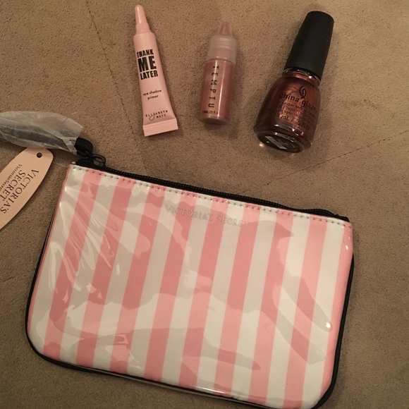 Victoria secret wristlet with 3 makeup items shown - Picture 1 of 4